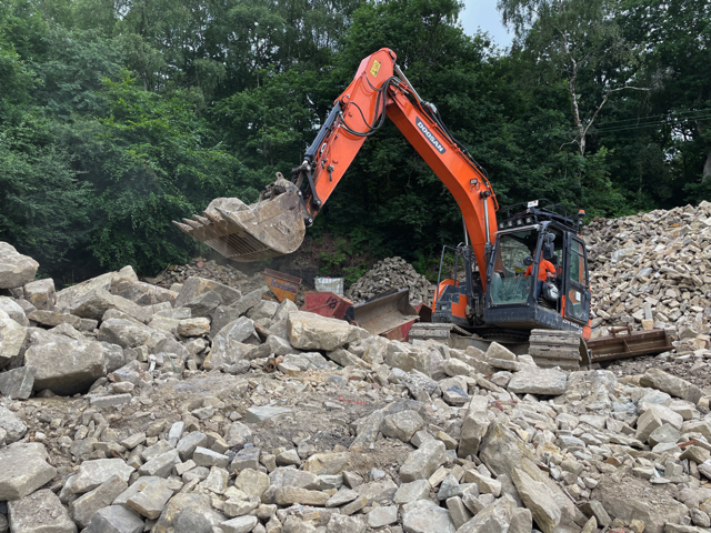 Stone pile with digger